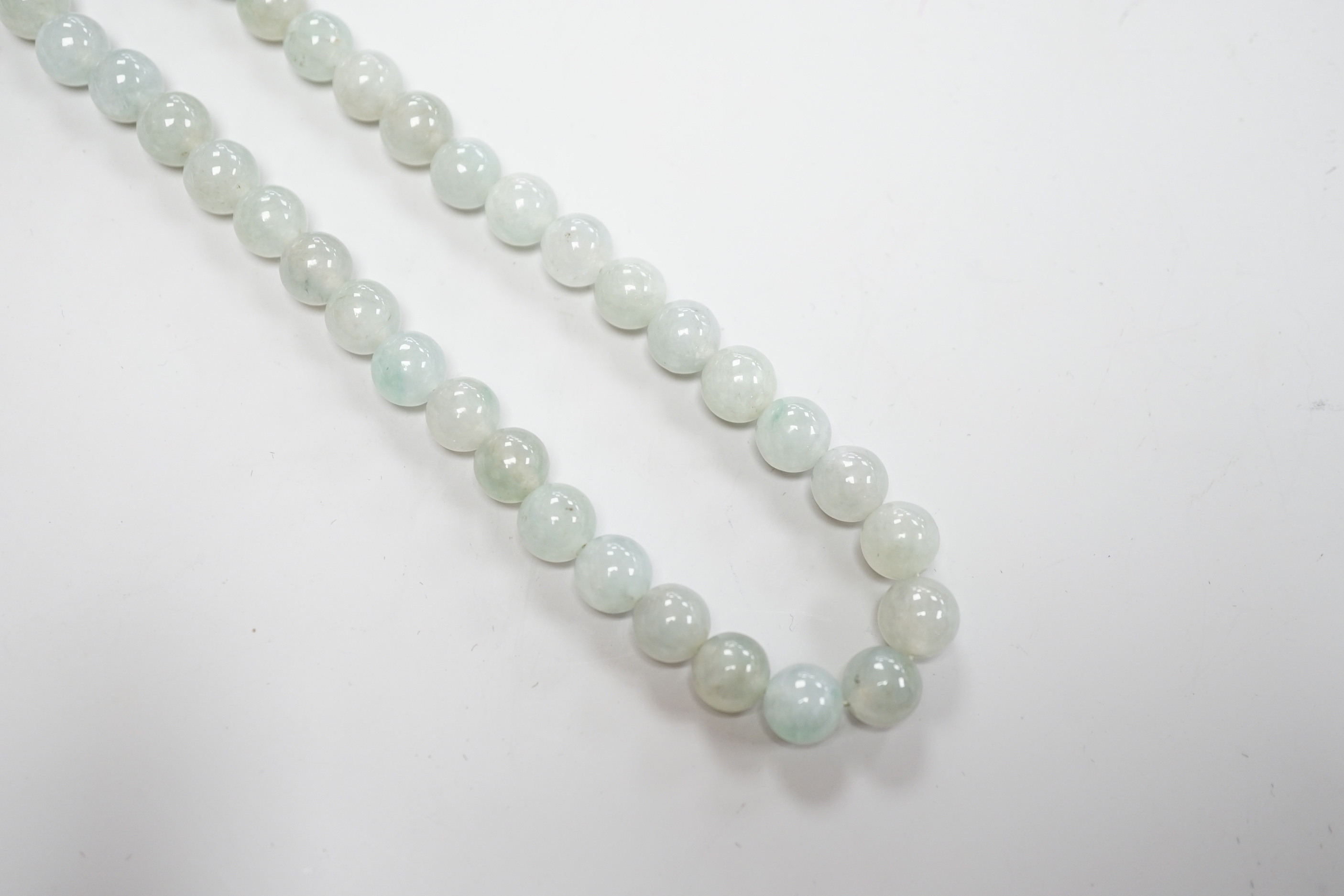 A single strand jadeite bead necklace, with 18k clasp, 43cm, gross weight 58.7 grams, with accompanying Gem & Pearl Laboratory report dated 18/03/2019, stating the jade to have no evidence of treatment.